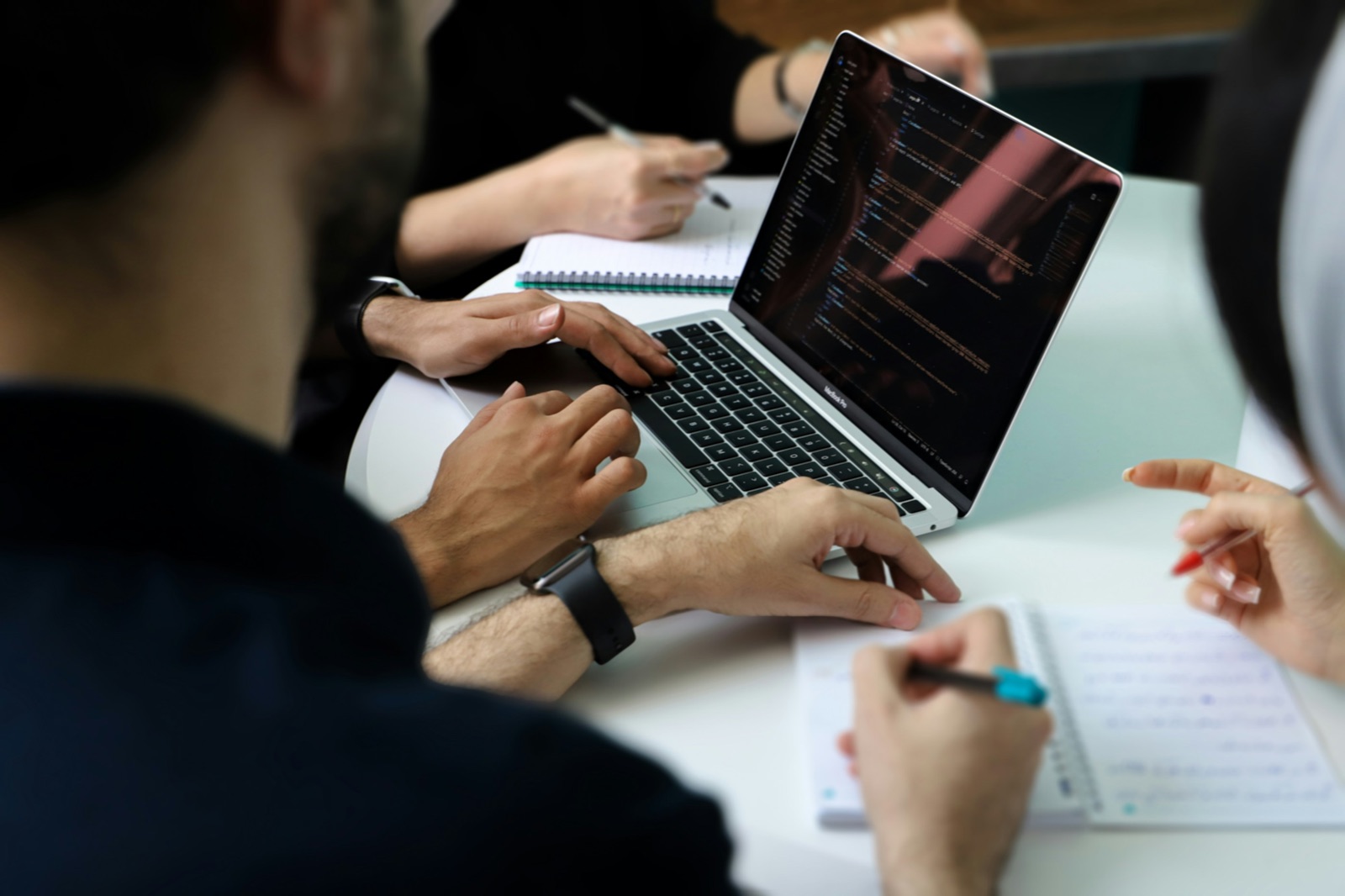 Advisers reviewing figures on a laptop